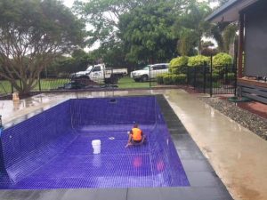 Man-cleaning-the-empty-pool - Pool & Spa in Kuranda, QLD