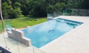 Pool with glass wall - Pool & Spa in Kuranda, QLD