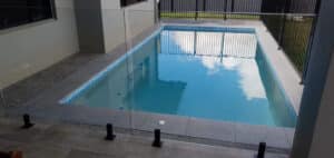Clean Pool with Transparent Glass Fence — Affordable Pools in Kuranda, QLD