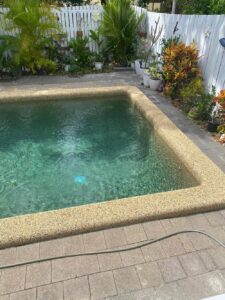 Clean Pool at the Garden with Wooden Fence — Affordable Pools in Kuranda, QLD