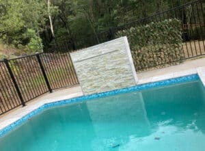 Waterfall wall on the pool — Affordable Pools in Kuranda, QLD